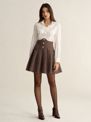 Jupe mini plissée taille haute pied-de-poule