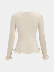 Top tricot fleuri bordure volantée