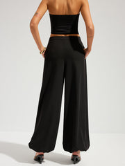 Pantalon ballon à rabat asymétrique noir, vue portée de dos