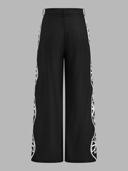 Pantalon noir brodé côté, pièce seule, vue de dos