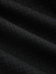 Blazer noir manches trois-quarts — gros plan sur le tissu texturé