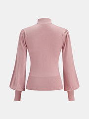 Pull col nœud laine
