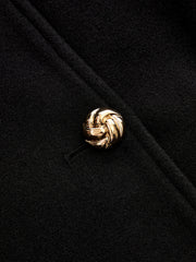 Manteau noir à col cape