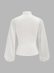 Blouse froncée croisée manches lanternes