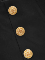 Pantalon ample à boutons dorés noir, détail des boutons