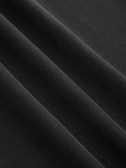 Pantalon ample à boutons dorés noir, détail du tissu