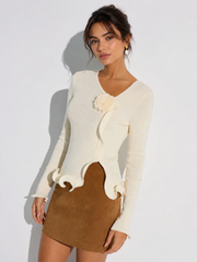 Top tricot fleuri bordure volantée
