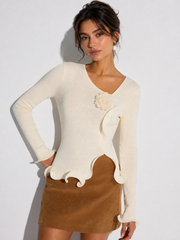 Top tricot fleuri bordure volantée
