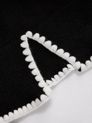 Pull bord festonné fendu