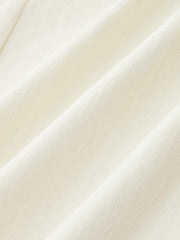 Pantalon évasé brodé ivoire, détail du tissu