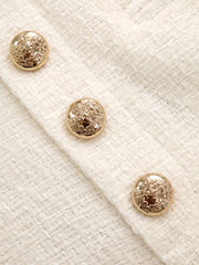 Pantalon tweed ivoire à boutons, détail des boutons