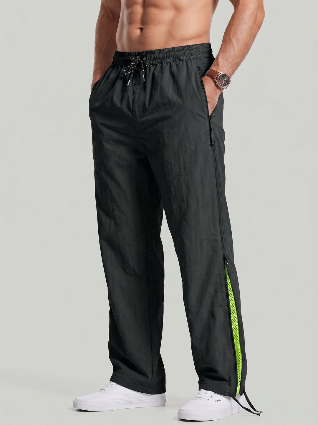 Pantalon ample noir à zip fluorescent, vue de face