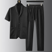 Ensemble polo et pantalon uni noir — vue à plat, chemise et pantalon accrochés