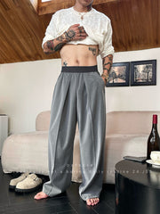 Pantalon ample uni à plis gris — détail taille élastique et coupe