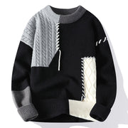 Pull à col rond noir, gris et écru, présenté de face.