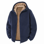 Veste bleu marine à capuche, ouverte de face avec doublure beige.