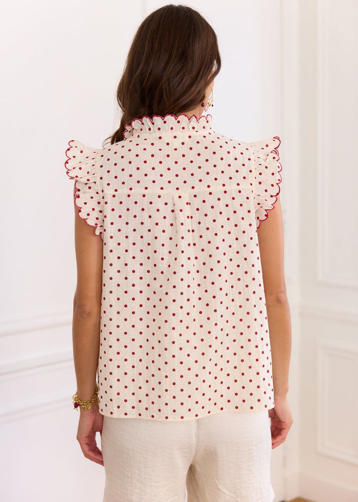 Blouse à pois rouge pinces poitrine