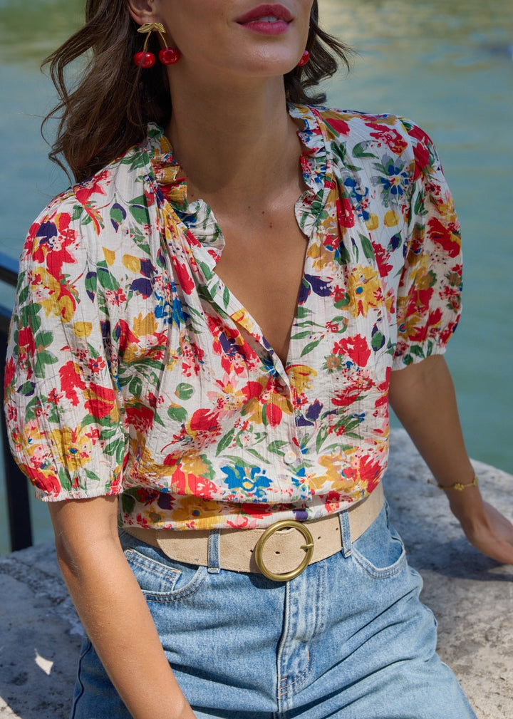 Blouse à motifs col rond volanté