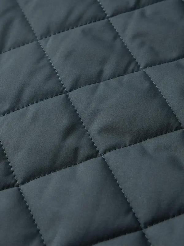 Blouson matelassé gris, détail des surpiqûres
