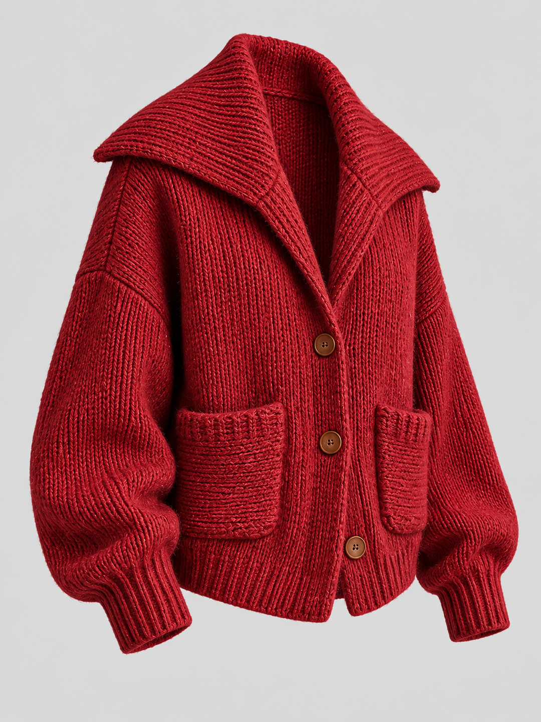Cardigan vermelho de malha com gola larga e bolsos, vista isolada de três quartos