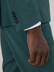 Costume 2 pièces vert bouteille — détail manche et boutons