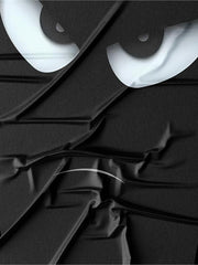 T-shirt noir à motif yeux — gros plan du motif des yeux à l'effet texturé