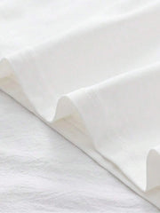 Haut de style urbain blanc — détail ourlet