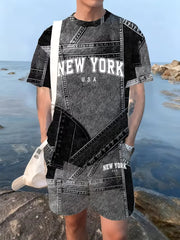 Homme portant un ensemble t-shirt et short à imprimé patchwork noir et gris, avec texte « New York ».