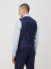 Gilet costume voyage bleu marine — vue portée de dos, sangle de réglage