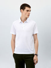 Polo ajusté en maille blanc — vue portée de face