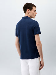 Polo maille bleu indigo — vue portée de trois-quarts dos