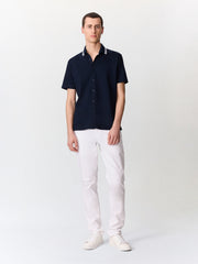 Polo maille bleu marine — vue portée en pied