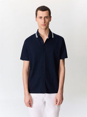 Polo maille bleu marine — vue portée de face