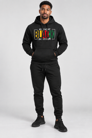 Ensemble veste capuche pantalon — noir porté en pied de face avec baskets noires
