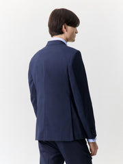 Veste costume croisée bleu marine — vue portée en pied, de dos