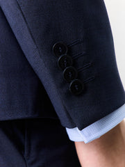 Veste costume croisée bleu marine — détail boutons de manche