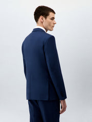 Veste de costume bleu indigo — vue portée de dos, trois-quarts